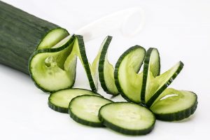 sliced cucumber on white table