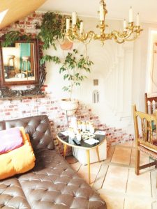 home brown leather bed near table and dining set