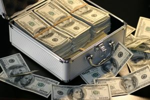 grey metal case of hundred dollar bills for home