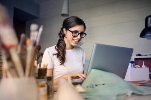 happy place at home photo of woman using her laptop