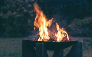 photography of wood burning on fire pit